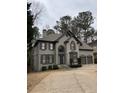 Charming two-story home with a well-maintained yard and two-car garage at 911 Laurel Crest Dr, Woodstock, GA 30189