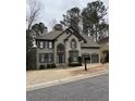 Charming two-story home with a well-maintained yard and two-car garage at 911 Laurel Crest Dr, Woodstock, GA 30189