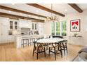 Bright, open kitchen features a large island, modern appliances, and natural light at 20 Swann Wynd, Chattahoochee Hills, GA 30268