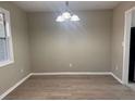 The dining room features modern flooring and a stylish light fixture, creating an inviting atmosphere at 25 Oak Crest Ct, Covington, GA 30016