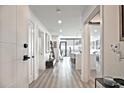 Hallway features wood flooring and a view of the kitchen at 788 W Marietta Nw St # 913, Atlanta, GA 30318