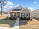 Charming single-story home with a well-manicured lawn, inviting entrance, and craftsman-style architecture at 804 White St, Villa Rica, GA 30180