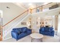 Spacious living room boasts high ceilings, natural light and a staircase leading to the upper level at 2160 Berryhill Se Cir, Smyrna, GA 30082