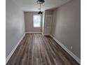 Well-lit bedroom with hardwood floors, neutral paint, and closet space at 2921 8Th St, East Point, GA 30344