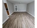 Spacious living room with modern hardwood floors, neutral paint, and plenty of natural light at 2921 8Th St, East Point, GA 30344