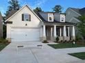 Beautiful craftsman style home featuring a two car garage, stone accents, and lovely landscaping at 866 Lakemont Dr, Canton, GA 30114