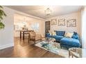 Open-concept living area with hardwood floors and modern furnishings, flowing into the kitchen at 1472 North Nw Ave, Atlanta, GA 30318