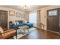 Bright living room featuring a stylish blue sofa and modern decor at 1472 North Nw Ave, Atlanta, GA 30318