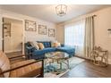 Cozy living room with a plush blue sofa, decorative art, and natural light at 1472 North Nw Ave, Atlanta, GA 30318