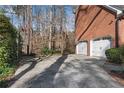 Spacious driveway leading to a two-car garage, offering ample parking space at 2170 Azalea Dr, Roswell, GA 30075