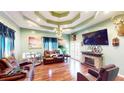 Open living room with fireplace, decorative ceiling, and lots of space for entertaining at 1724 Hill Ne St, Conyers, GA 30012
