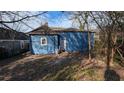 Backyard view of a blue home with a white door and window at 884 Mcdaniel Sw St, Atlanta, GA 30310