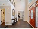Bright foyer features a soaring ceiling, hardwood floors, and a striking front door with leaded glass sidelights at 4324 Halifax Ne Ter, Roswell, GA 30075
