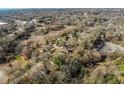 Extensive aerial view of a residential area with dense trees, homes, and a road in the background at 1255 North Nw Ave, Atlanta, GA 30318