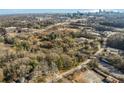 Expansive aerial view showcasing lush trees, with the city skyline in the background at 1255 North Nw Ave, Atlanta, GA 30318
