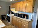 Traditional kitchen featuring light wood cabinetry, tile countertops, and modern appliances, perfect for Gathering meals at 1255 North Nw Ave, Atlanta, GA 30318