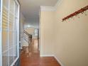 Bright foyer with hardwood floors, coat hooks, and views into the living area at 6179 Bellewood Ash Ln, Tucker, GA 30084
