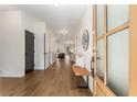 Bright foyer boasts hardwood floors, bench, and elegant front door at 2261 Venetian Dr, Atlanta, GA 30311