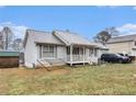 Charming single-story home featuring a covered front porch and a well-maintained lawn at 160 Wesley Chapel Rd, Villa Rica, GA 30180