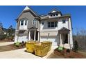 New two-story home with gray and white facade and two-car garage at 201 Retreat Ln, Canton, GA 30114
