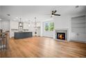 Open floor plan featuring hardwood floors, fireplace, and spacious kitchen with center island at 201 Retreat Ln, Canton, GA 30114