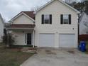 Inviting two-story home with attached garage and a well-maintained lawn, located in a desirable neighborhood at 4423 Gladewood Run, Union City, GA 30291