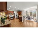 Open kitchen with stainless steel appliances, granite countertops, and breakfast bar at 950 Whitetail Ct, Alpharetta, GA 30005