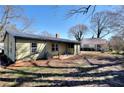 A spacious backyard featuring green grass, utility access, and great lighting at 127 Holly St, Social Circle, GA 30025