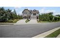 Beautiful townhome on a corner lot, with a lovely yard and long driveway at 203 Retreat Ln, Canton, GA 30114