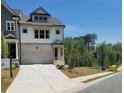 Inviting home with a two-car garage, tidy landscaping, and a welcoming entrance at 203 Retreat Ln, Canton, GA 30114