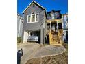 Charming two-story home featuring a covered porch and attached garage at 8056 S Bay Ct, Riverdale, GA 30274