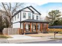Beautiful two-story home boasts a covered front porch with a spacious driveway at 569 Hope Sw St, Atlanta, GA 30310