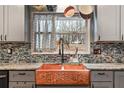 Close up of kitchen sink featuring stainless steel appliances, custom cabinets, and copper farmhouse sink at 270 Cochran Ridge Rd, Dallas, GA 30157