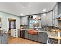 Cozy kitchen featuring stainless steel appliances, custom cabinets, and copper farmhouse sink at 270 Cochran Ridge Rd, Dallas, GA 30157