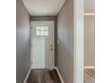 A welcoming entryway with a modern front door and hardwood floors at 3111 Flat Shoals Rd, Decatur, GA 30034