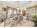 Formal dining area with an ornate table, chairs, and decorative display cabinet at 854 Malvern Blvd, Stone Mountain, GA 30087