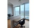 Living room featuring a desk area, large window and city views at 361 17Th Nw St # 2308, Atlanta, GA 30363