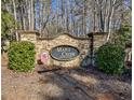 Stone community sign for Maple Creek, surrounded by lush greenery at 1137 Maple Creek Rdg, Loganville, GA 30052