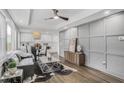 Open-concept living space with hardwood floors, modern decor, and a view into the kitchen at 1459 Kenilworth Sw Dr, Atlanta, GA 30310