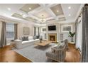 Bright living room with coffered ceiling, fireplace, and modern furnishings at 1590 N Morningside Ne Dr, Atlanta, GA 30306