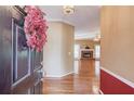 Inviting living room featuring hardwood floors, a cozy fireplace, and neutral paint, creating a warm atmosphere at 868 Clarion Way, Lawrenceville, GA 30044