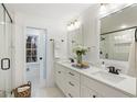 Elegant bathroom featuring double vanity, glass shower with marble tile, and stylish modern fixtures at 5548 Martina Way, Atlanta, GA 30338