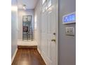 Welcoming hallway with gleaming hardwood floors and an elegant mirror at 3831 Austin Park Ln, Decatur, GA 30032