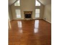 Bright living room with hardwood floors, a stone fireplace, and large windows at 4333 S Landing Dr, Marietta, GA 30066