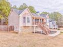 Inviting two-story home showcasing stone accents and a spacious deck at 171 W Fork Way, Temple, GA 30179