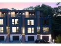 Townhome exterior with multiple balconies, modern design, and well-lit entrances at 1570 Flat Shoals Se Rd # 7, Atlanta, GA 30316