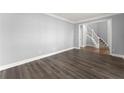 Modern living room features light walls and wood flooring at 4391 Chatuge Dr, Buford, GA 30519