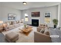 Bright living room with fireplace, neutral tones, and ample natural light at 4906 Laythan Jace Ct, Snellville, GA 30039