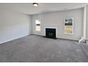 Spacious living room with a fireplace and large windows at 4906 Laythan Jace Ct, Snellville, GA 30039