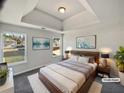 Serene main bedroom featuring a tray ceiling and plush carpet at 4906 Laythan Jace Ct, Snellville, GA 30039